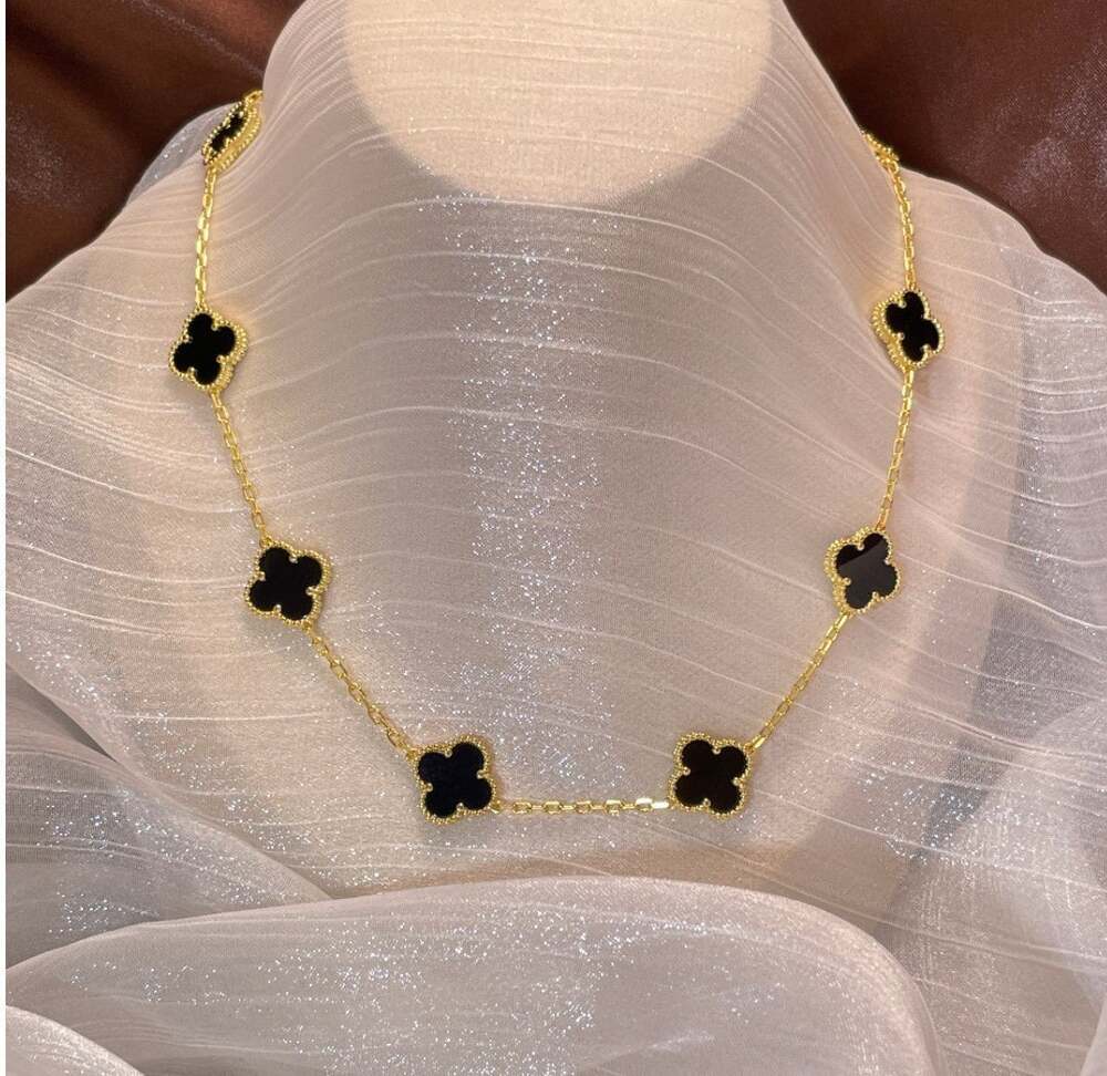10 clover necklace black and gold